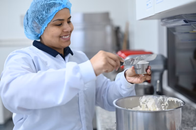A laboratory personnel inside the Palsgaard Brazil bakery application center working on cake mix emulsifiers
